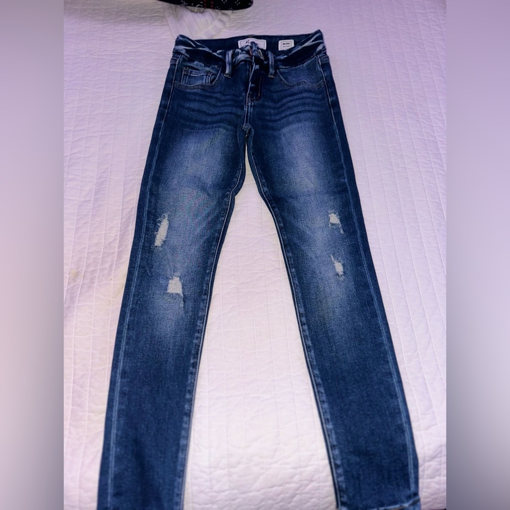 Girl ripped jeans